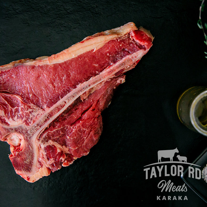 Indulge in Taylor Road Meats&#39; premium Beef T-Bone Steak, featuring tender fillet on one side and flavourful sirloin on the other, perfect for grilling or pan-searing to perfection